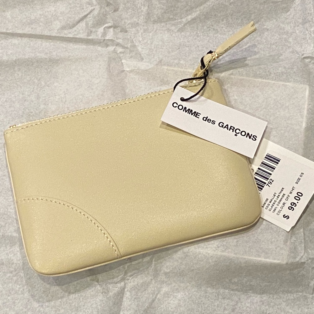 BNIB buttery smooth Comme des Garçons “wallet.”